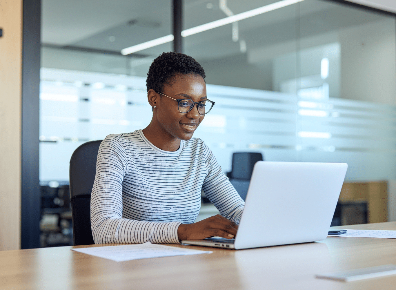 woman professional on laptop working smiling